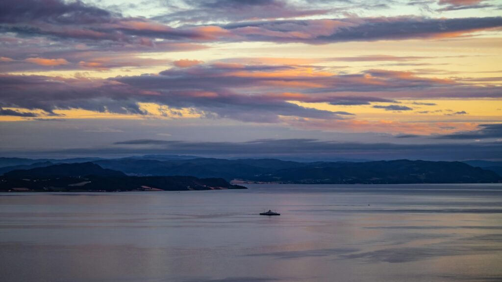 Serene sunset view over Trondheim Fjord, capturing the calm waters and picturesque sky.
